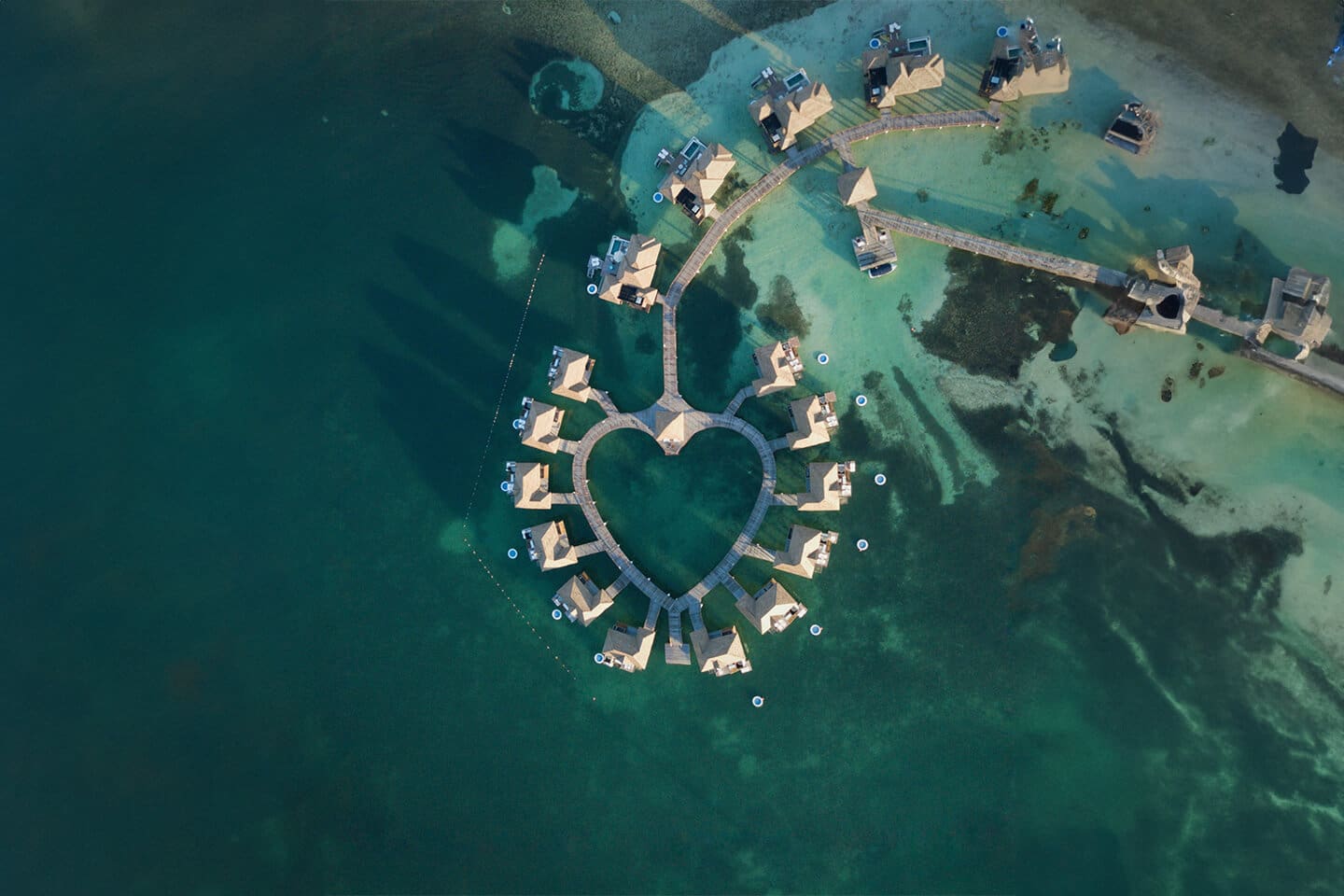 A heart shaped island in the middle of the ocean.