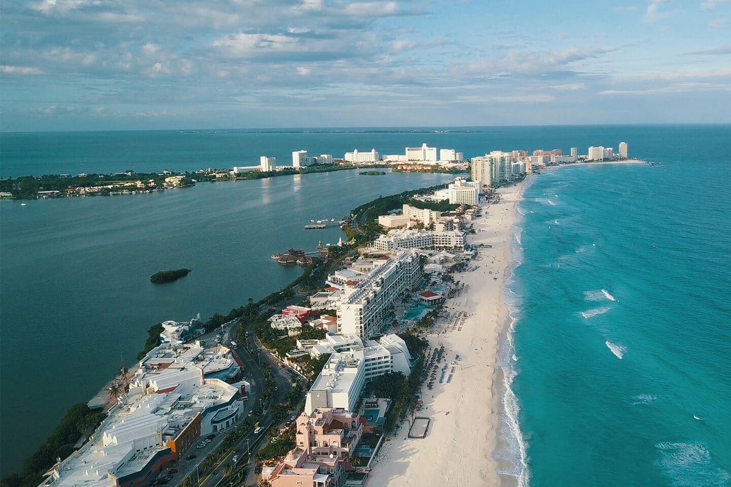 A view of the ocean and beach from above.