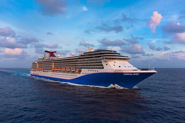 A large cruise ship sailing in the ocean.